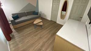 Deluxe Suite, 2 Bedrooms | Living area - Salt Air Lodge (Santa Cruz)