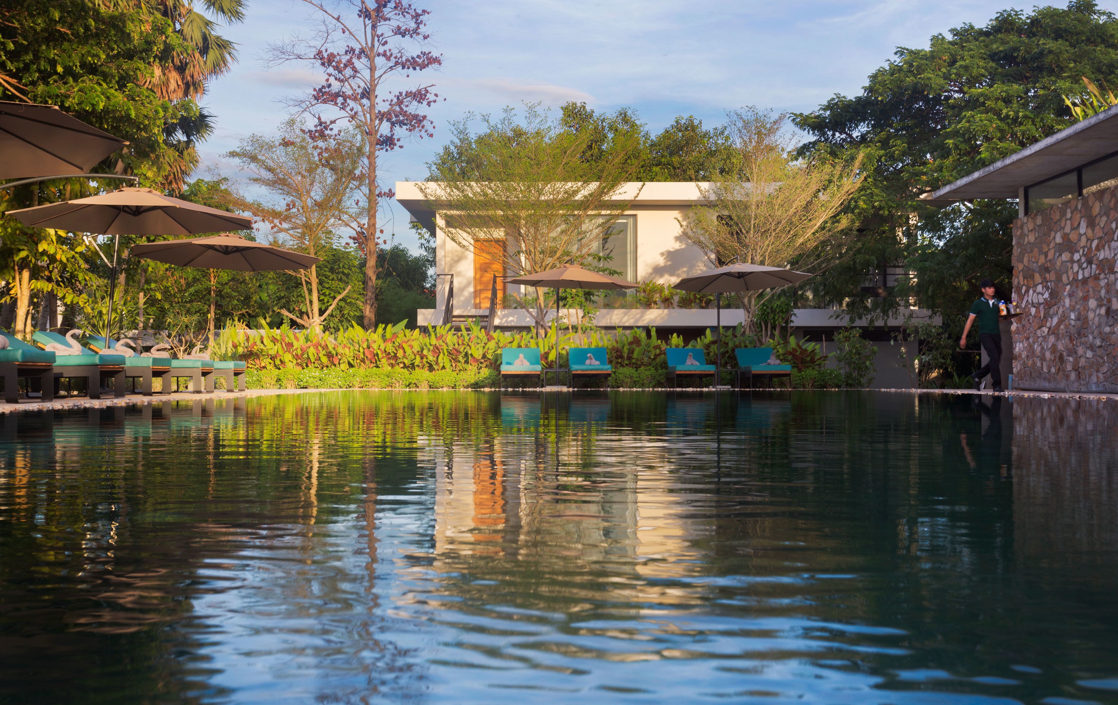 outdoor pool, open 9:00 am to 10:00 pm, pool umbrellas, pool loungers