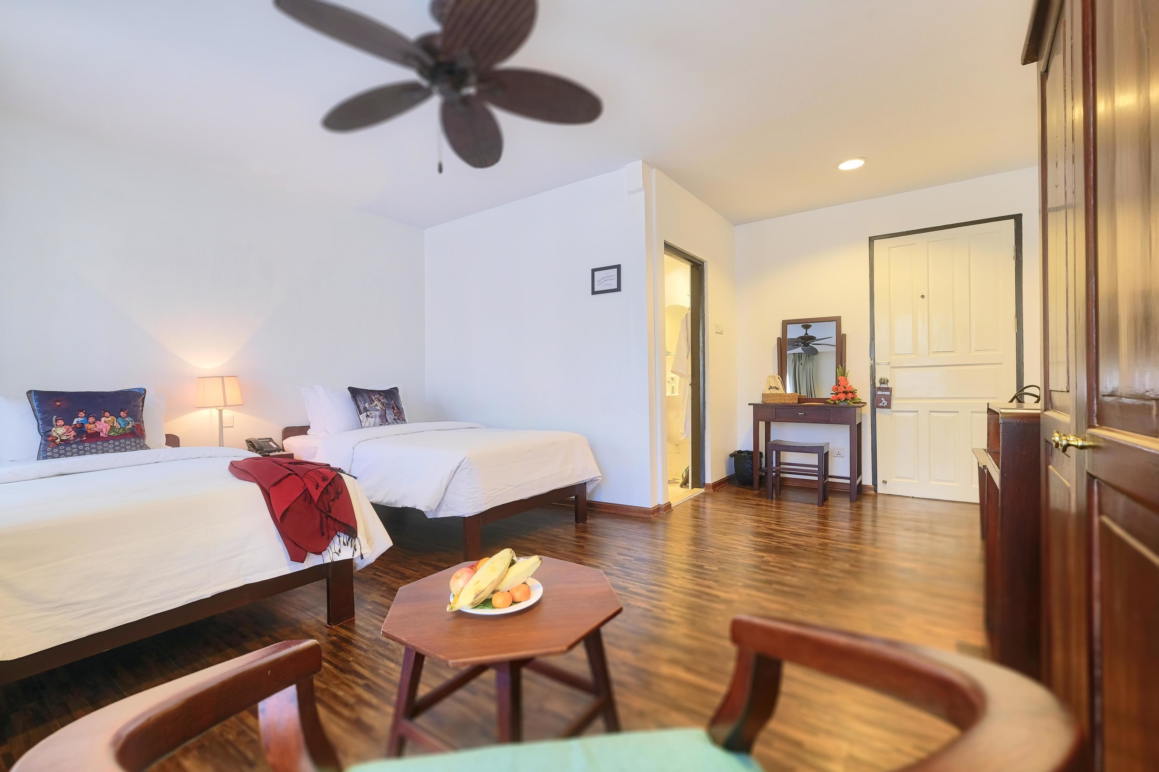 classic double or twin room, garden view | 1 bedroom, in-room safe, individually decorated, individually furnished