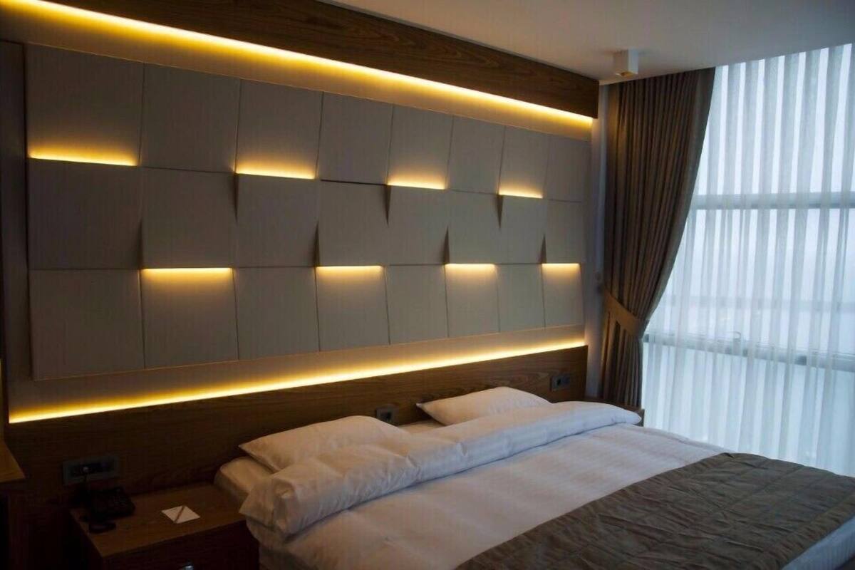 Double Room, Partial Sea View | Minibar, in-room safe, desk, free cots/infant beds
