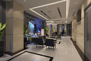 A modern hotel lobby with a seating area, a large window with a view, and a reception desk. -  Calista Sai Gon Hotel (Ho Chi Minh City)