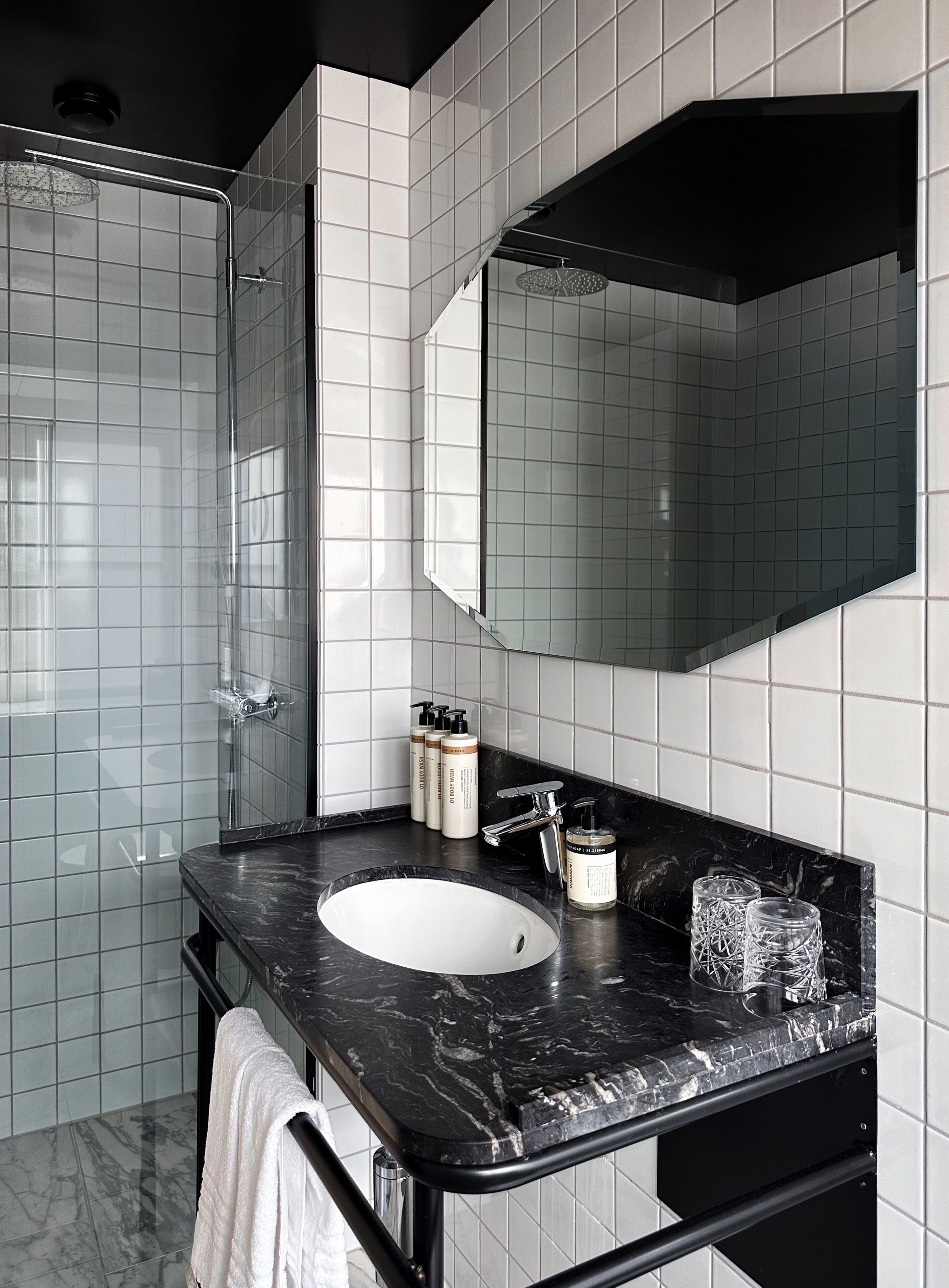 designer toiletries, hair dryer, towels, soap