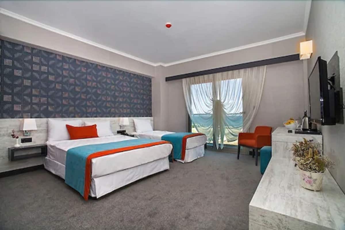 Standard Triple Room | Minibar, in-room safe, desk, soundproofing