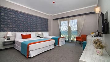 Standard Triple Room | Minibar, in-room safe, desk, soundproofing