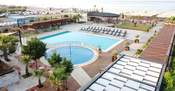 Indoor pool, outdoor pool, pool umbrellas, pool loungers