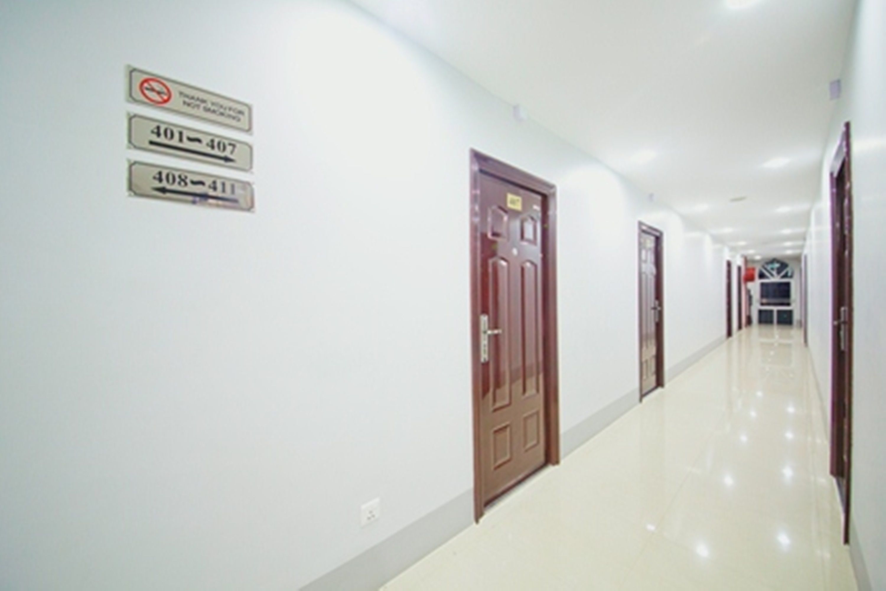 A long, narrow hallway with doors numbered 401-407 and 408-411.