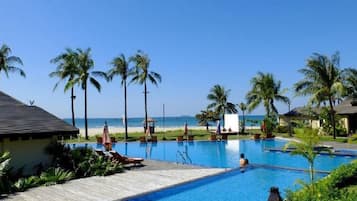 Relax by the pool with a clear view of the ocean.