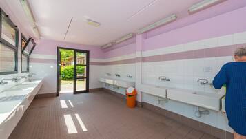 Clean and well-appointed restroom with multiple sinks and mirrors.