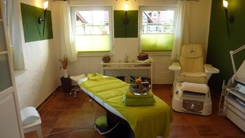 Relax in comfort with a single bed, a massage chair, and a soothing atmosphere.