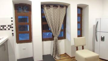 City Studio Suite, 2 Double Beds, Smoking, City View | Living room | 42-inch plasma TV with cable channels, TV, DVD player