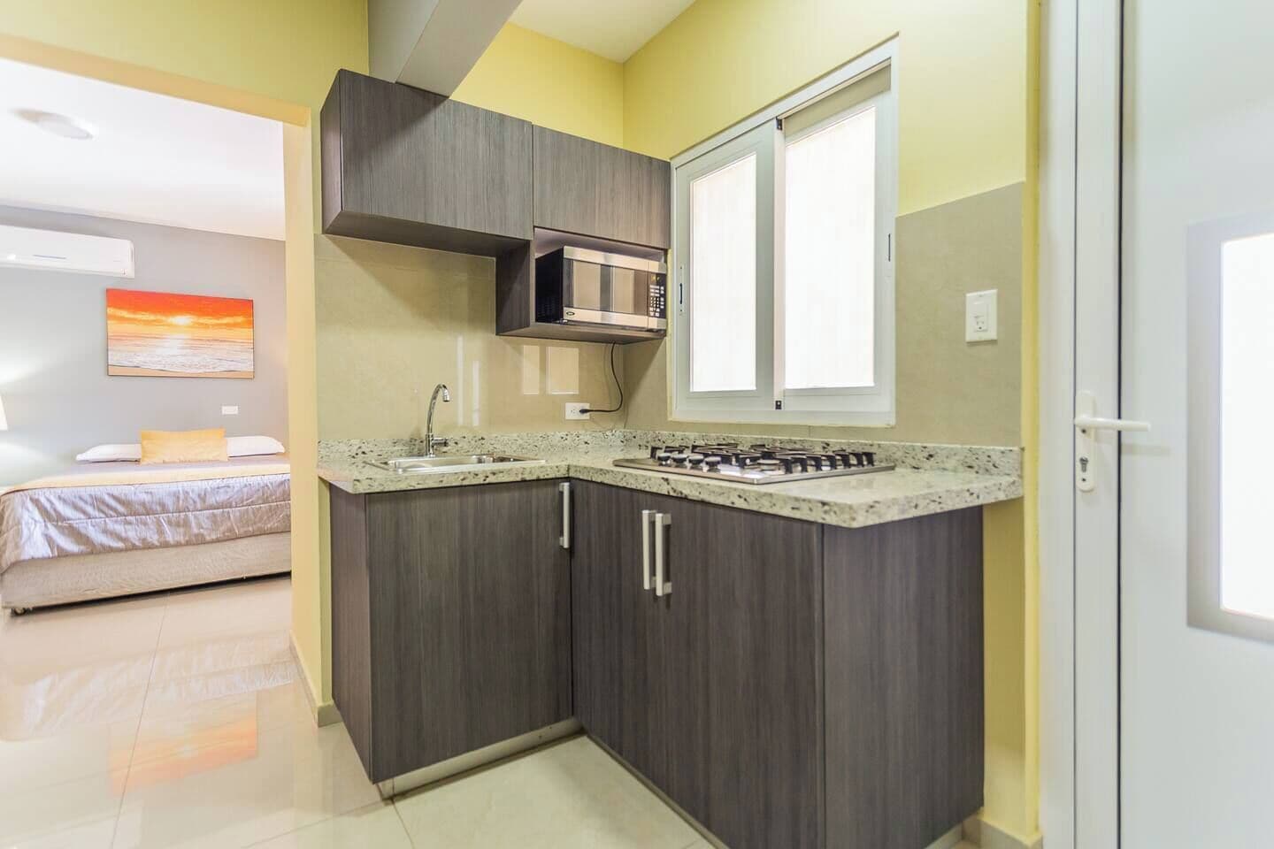 classic room, 1 queen bed | private kitchenette | full-sized fridge, microwave, coffee/tea maker, toaster