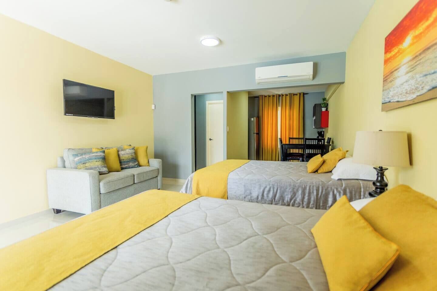 economy double room, 2 queen beds | in-room safe, soundproofing, iron/ironing board, rollaway beds