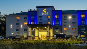 A Comfort Inn & Suites hotel with a modern design, featuring a prominent entrance and multiple windows. - Comfort Inn & Suites (Terrace)