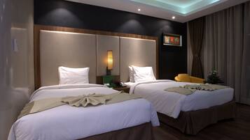 Minibar, coffres-forts dans les chambres, bureau