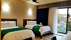 Down comforters, free minibar, in-room safe, desk - Isla Natura Beach Huatulco (Santa María Huatulco)