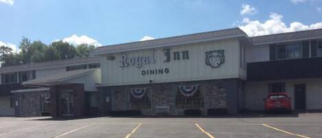 A building with a sign reading "Royal Inn Dining".