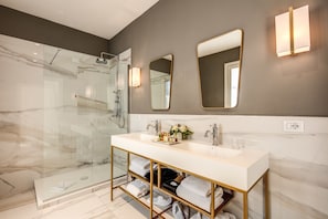 Designer toiletries, hair dryer, bathrobes, slippers