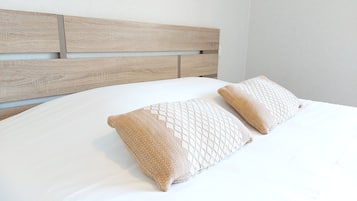 Desk, laptop workspace, free WiFi, bed sheets