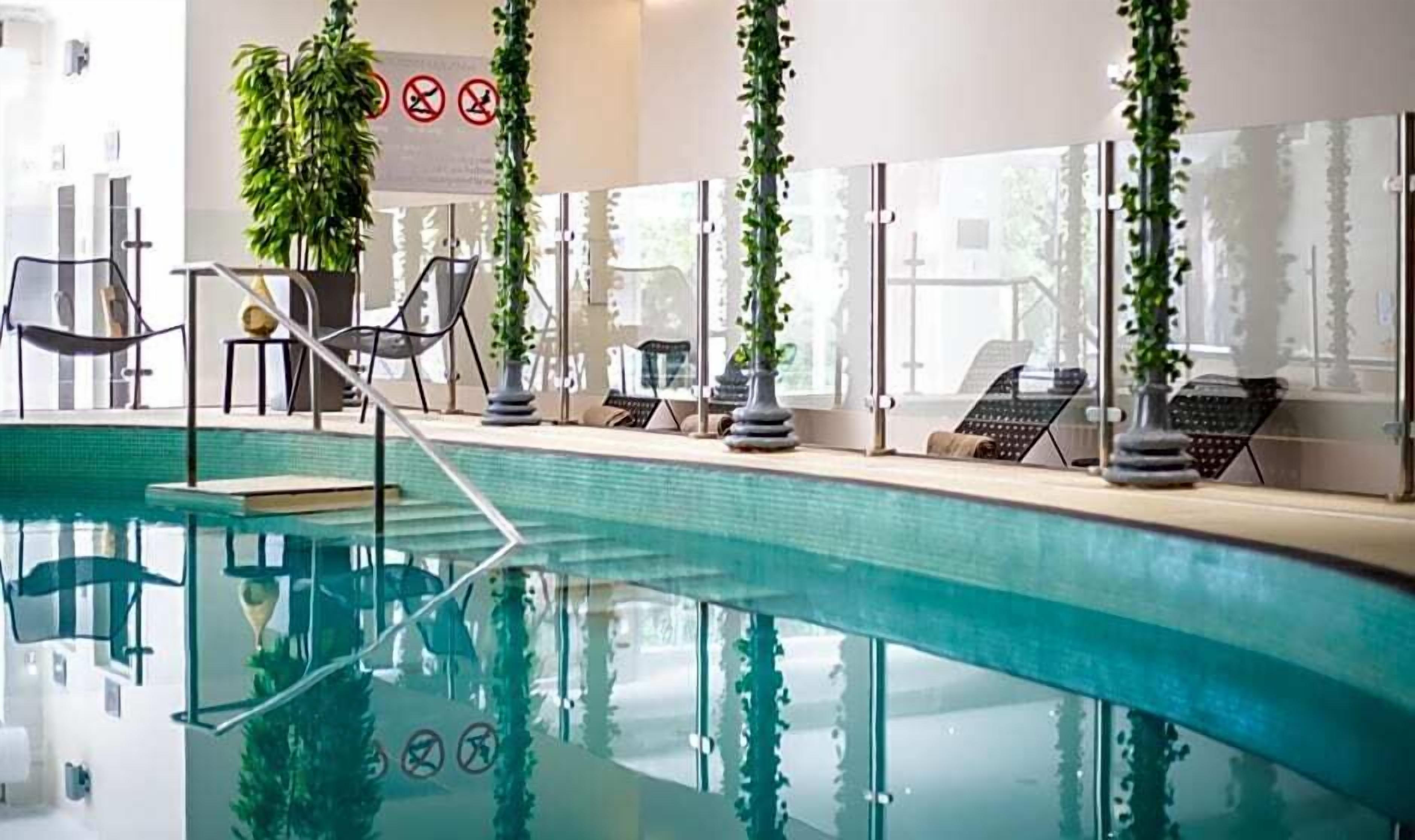 Indoor pool, open 8:00 AM to 9:00 PM, pool loungers