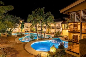 Outdoor pool, pool umbrellas, sun loungers