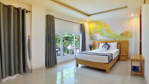 A modern bedroom with a large bed, a wooden headboard, a nightstand, and a window with curtains. - You And Me Hotel (Ho Chi Minh City)
