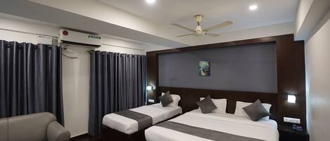 Deluxe Triple Room (with AC) | Premium bedding, in-room safe, desk, rollaway beds