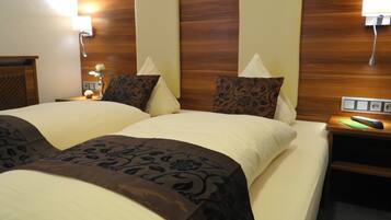 Premium bedding, down duvets, memory-foam beds, desk