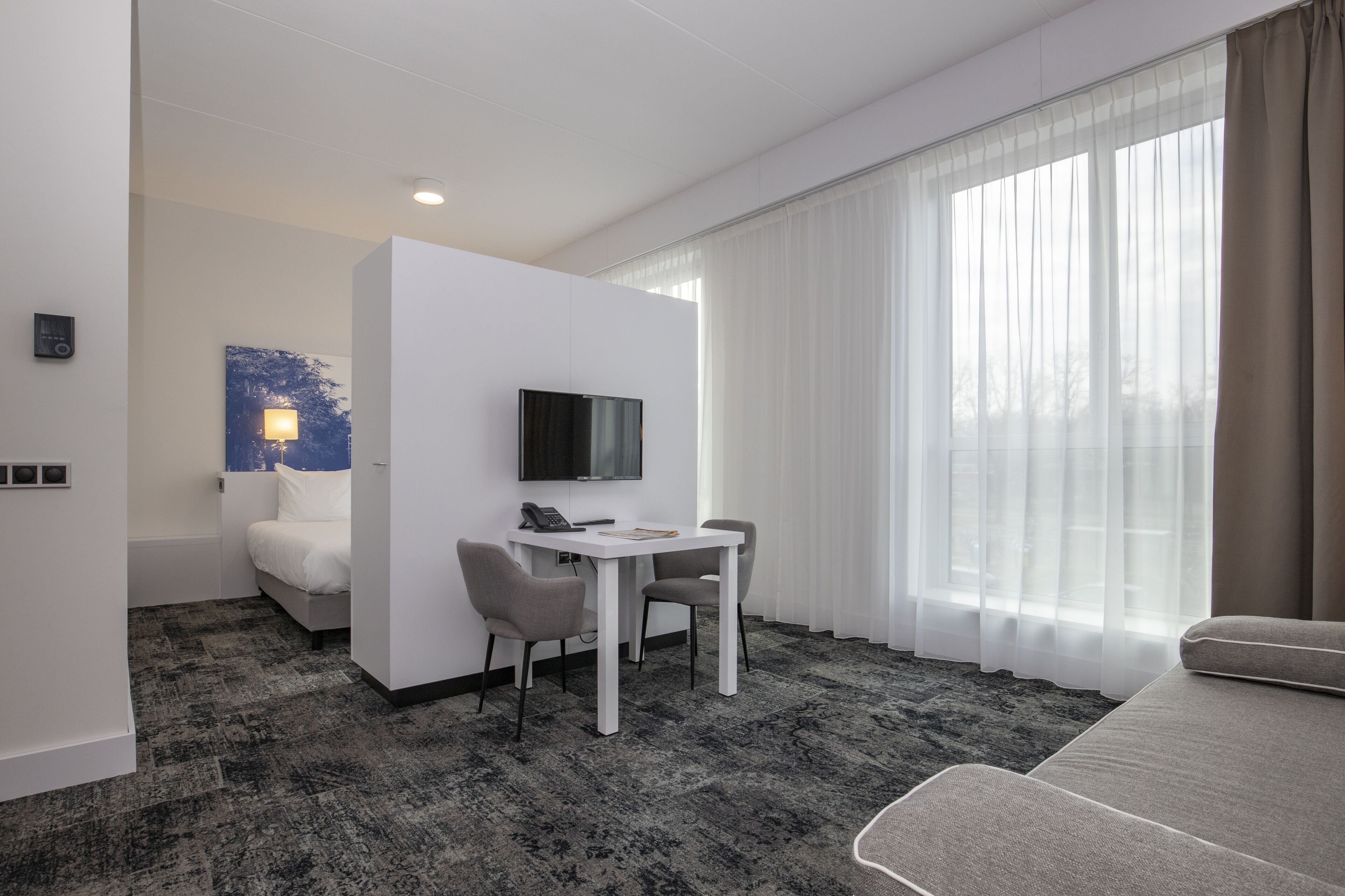 junior suite | in-room safe, desk, laptop workspace, iron/ironing board