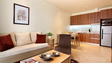 Executive Room, 2 Bedrooms | Living area | 40-inch LED TV with cable channels, TV