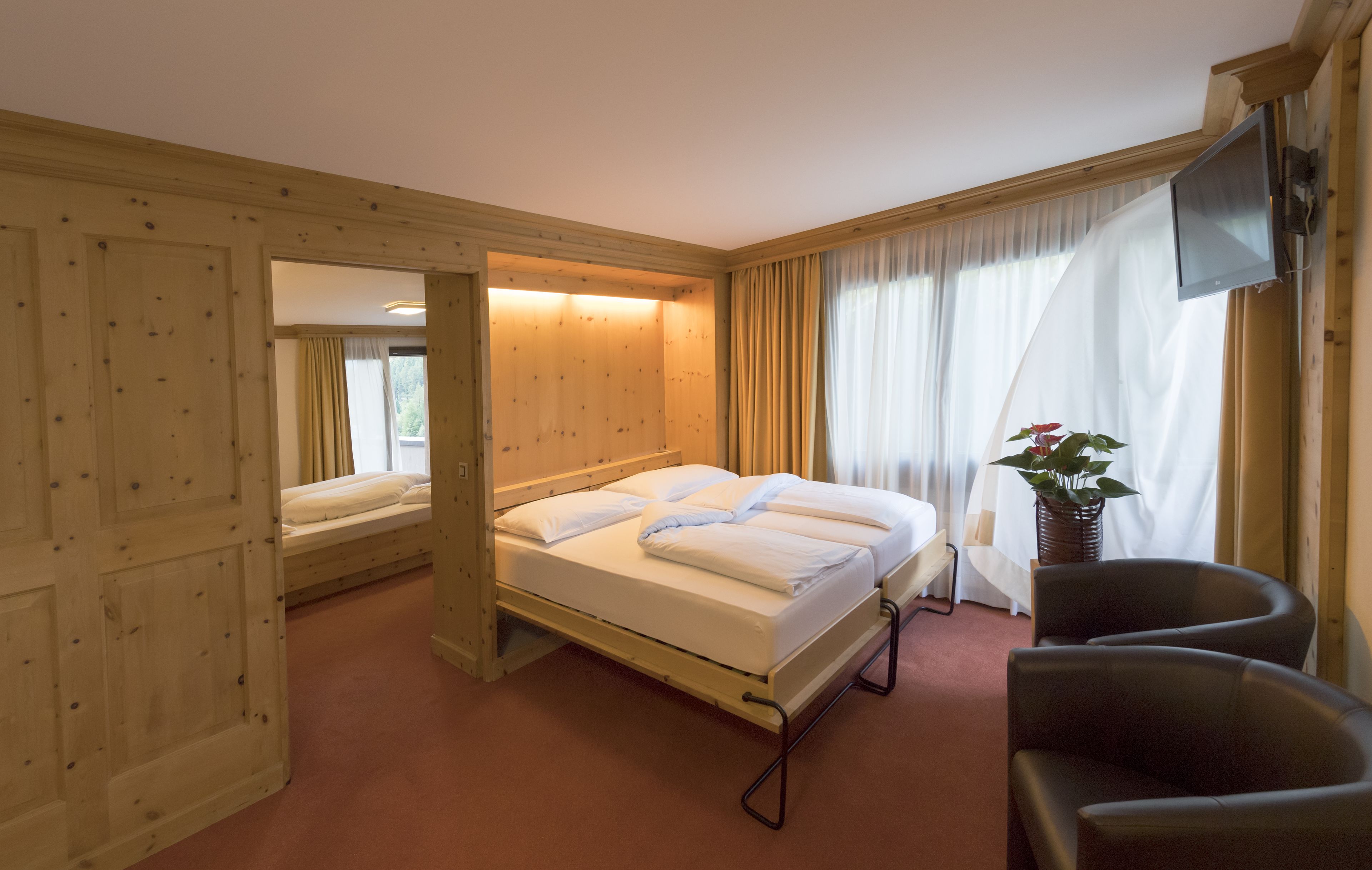 family room, 2 bedrooms, mountain view | in-room safe, desk, iron/ironing board, cots/infant beds