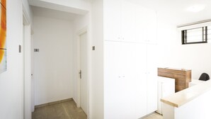 A hallway with a door marked '3' and a reception desk with a wooden counter. - Kissamia - Self Check In Only - Next to Night Clubs (Kissamos)