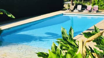 Seasonal outdoor pool, pool umbrellas, pool loungers