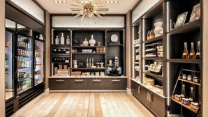 Una cocina moderna con armarios de madera oscura, una isla central y varios electrodomésticos.