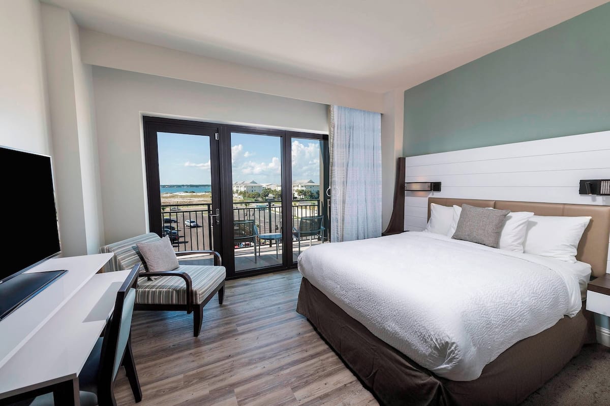 Premium bedding, desk, laptop workspace, blackout drapes