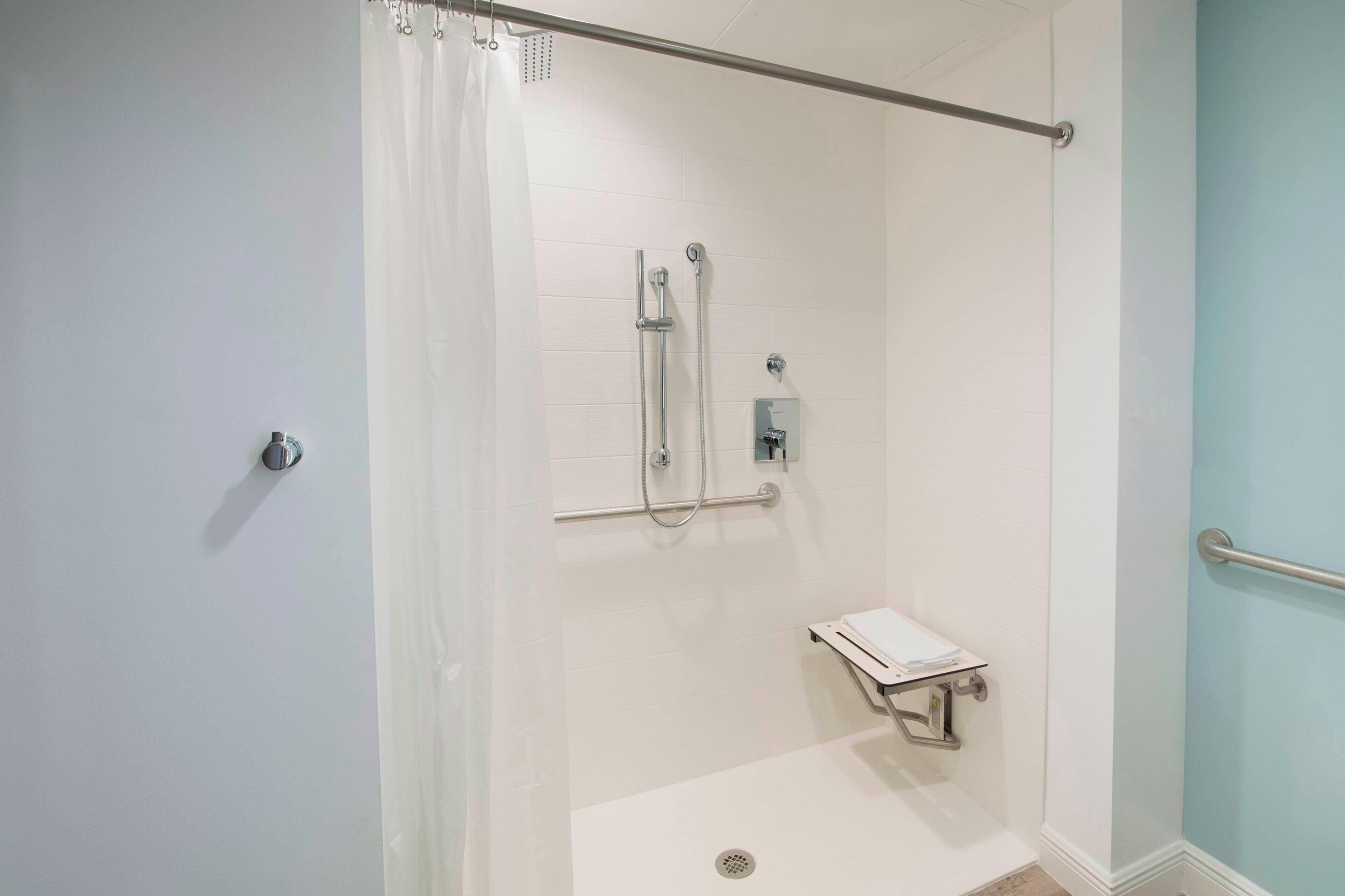 A walk-in shower with a glass door, a handheld showerhead, a handheld showerhead, a handheld showerhead, a handheld showerhead, a handheld showerhead, a handheld showerhead, a handheld showerhead, a handheld showerhead, a handheld showerhead, a handheld showerhead, a handheld showerhead, a handheld showerhead, a handheld showerhead, a handheld showerhead, a handheld showerhead, a handheld showerhead, a handheld showerhead, a handheld showerhead, a handheld showerhead, a handheld showerhead, a handheld showerhead, a handheld showerhead, a handheld showerhead, a handheld showerhead, a handheld showerhead, a handheld showerhead, a handheld showerhead, a handheld showerhead, a handheld showerhead, a handheld showerhead, a handheld showerhead, a handheld showerhead, a handheld showerhead, a handheld showerhead, a handheld showerhead, a handheld showerhead, a handheld showerhead, a handheld shower