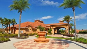 A hotel with a central courtyard, palm trees, and a checkered floor pattern. - 601 Bella Vida Condo 4 Bedroom by Florida Star (Kissimmee)