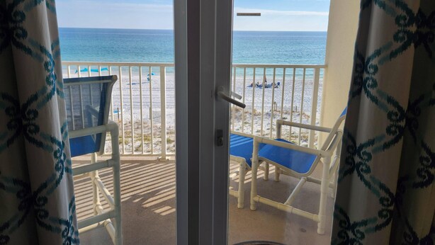 A balcony with a view of the beach and ocean. - 3rd Floor SeaDunes 3 Bedroom Apartment by BnD (Fort Walton Beach)
