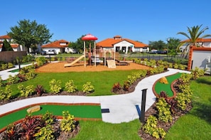 Children can play safely in the enclosed play area with a slide and climbing structures.