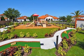 Children can play safely in this well-maintained outdoor area with a play structure and climbing elements.