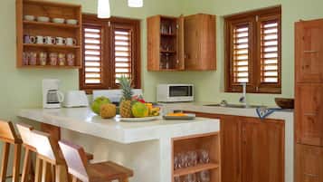 Deluxe Cottage, 3 Bedrooms | Private kitchen | Full-size fridge, oven, stovetop, coffee/tea maker