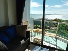 Superior Sea View | Living area | 32-inch flat-screen TV with cable channels, TV