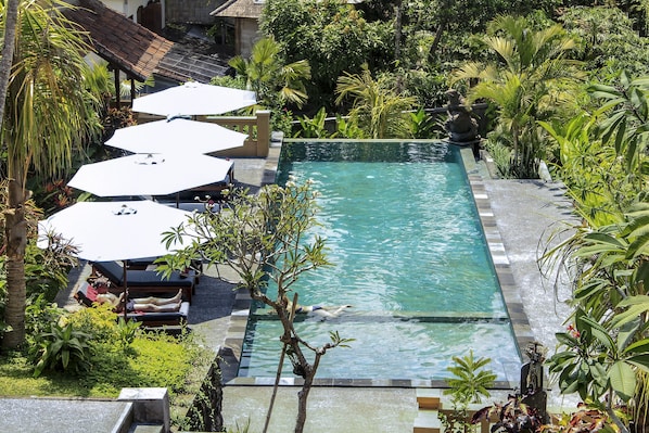 Outdoor pool, open 7:00 AM to 7:00 PM, pool umbrellas, sun loungers