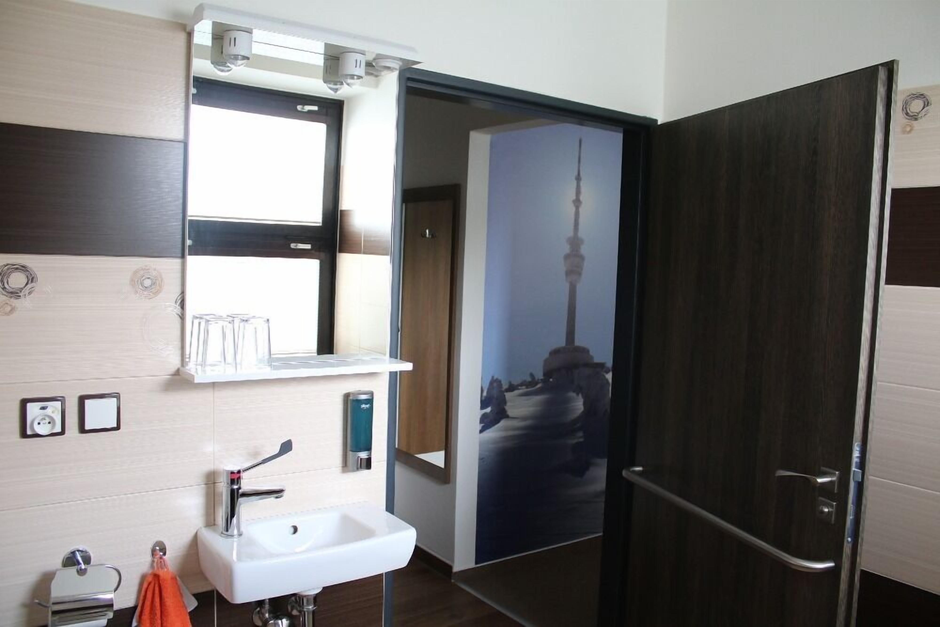 twin room (disability access) | bathroom amenities | shower, free toiletries, hair dryer, towels