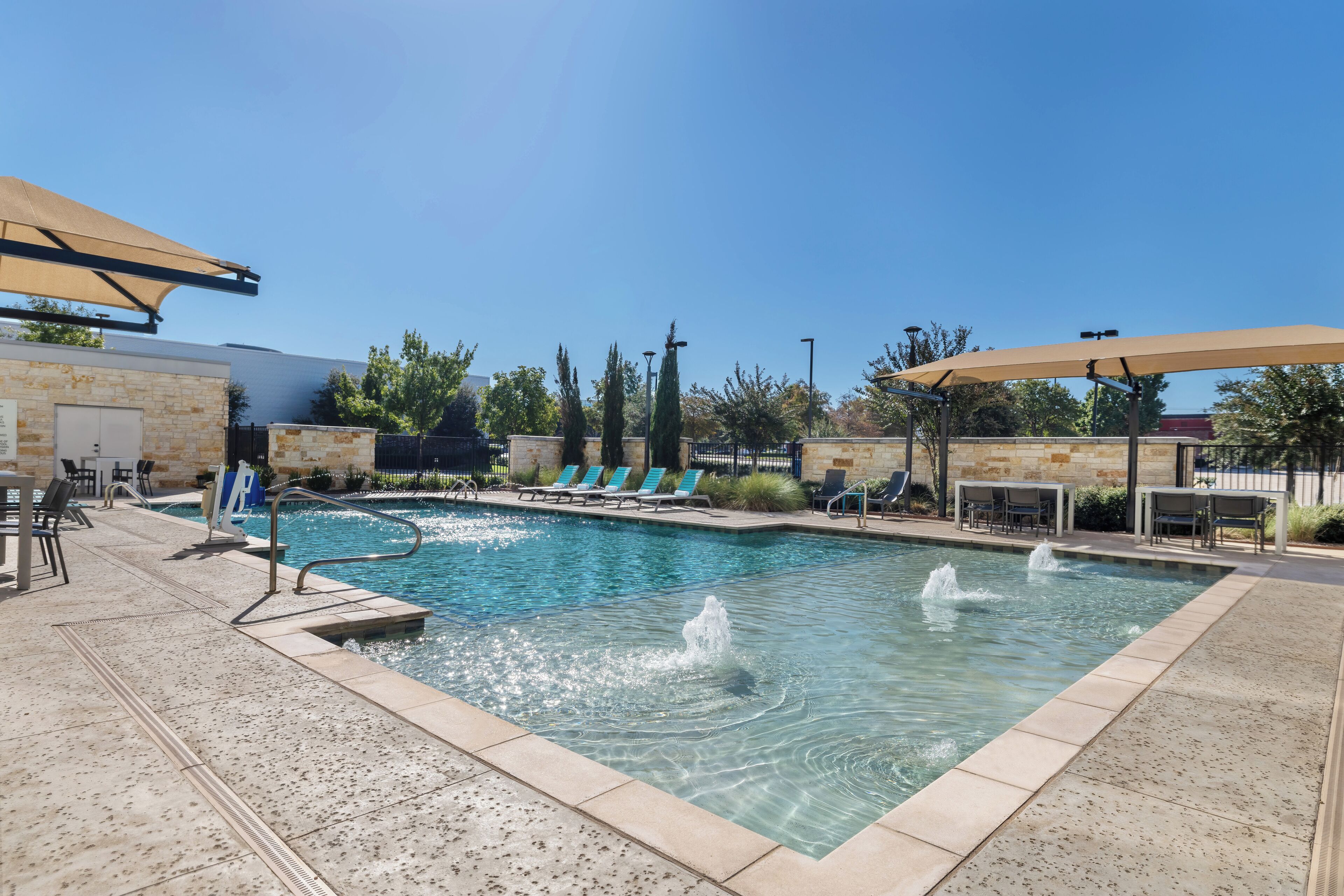 outdoor pool, open 10:00 am to 10 pm, pool umbrellas, pool loungers