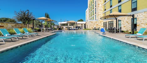 Outdoor pool, open 10:00 AM to 10 PM, pool umbrellas, sun loungers