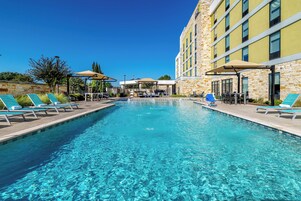 Outdoor pool, open 10:00 AM to 10 PM, pool umbrellas, sun loungers