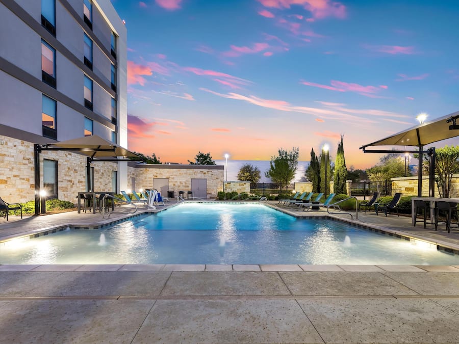 Outdoor pool, open 10:00 AM to 10 PM, pool umbrellas, sun loungers