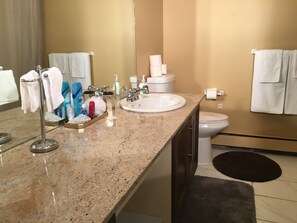 Superior Condo, 2 Bedrooms | Bathroom | Free toiletries, towels - Olympic Suites (Calgary)