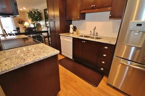 Enjoy meals in the kitchen with a dishwasher and granite countertop.
