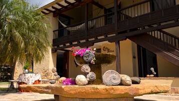 Surround yourself with serenity amidst lush surroundings and a soothing fountain.